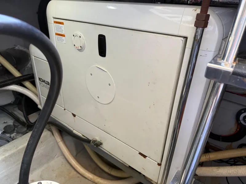 Slide: The Image of Engine room of 1998 Carver 530 VOYAGER with Kohler power generator. - 26