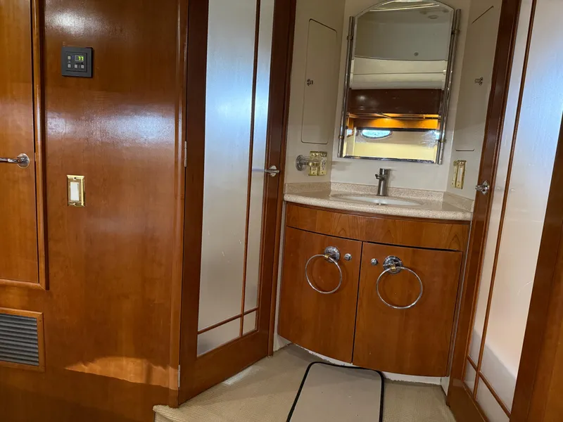 Slide: The Image of Luxurious bathroom interior of 1998 Carver 530 Voyager yacht with wooden cabinetry. - 40