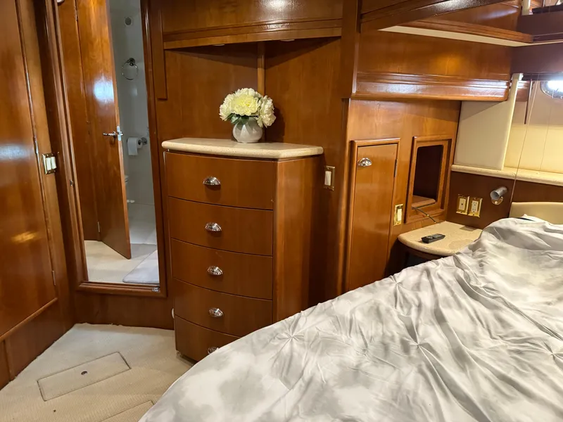 Slide: The Image of Luxurious 1998 Carver 530 Voyager yacht interior with wooden cabinetry and elegant decor. - 45