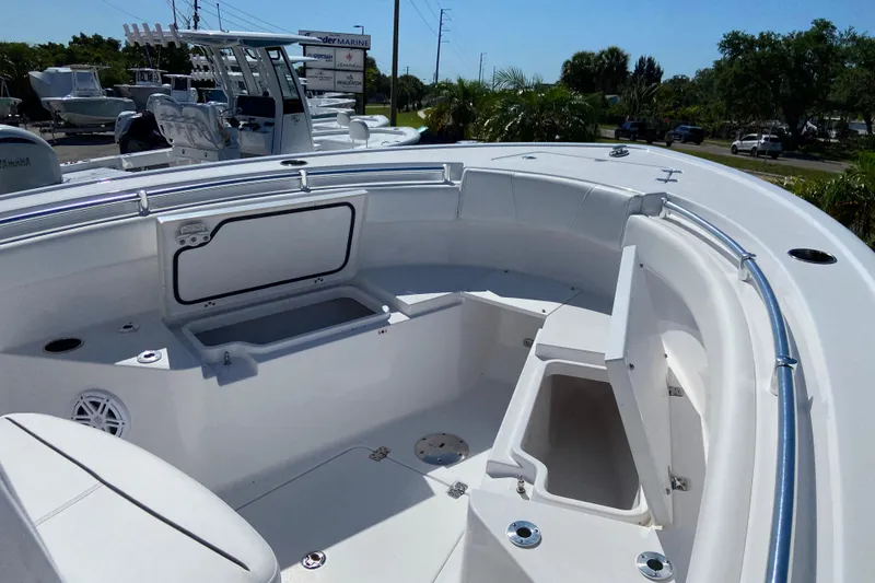 Slide: The Image of 2025 Sportsman Open 212 Center Console boat interior with seating and storage compartments. - 18