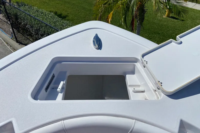 Slide: The Image of Open storage compartment on 2025 Sportsman Open 212 Center Console boat. - 20