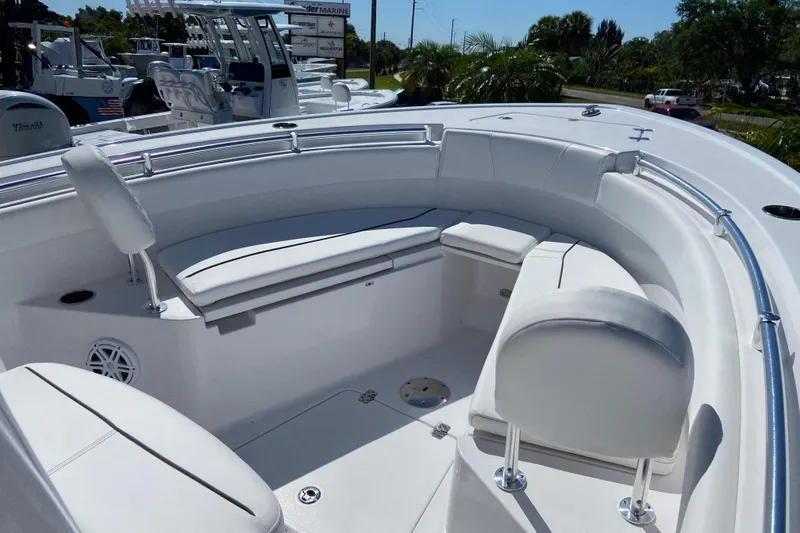 Slide: The Image of 2025 Sportsman Open 212 Center Console boat with white seating and stainless steel railings. - 21