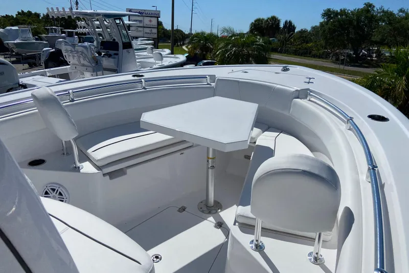 Slide: The Image of 2025 Sportsman Open 212 Center Console boat with spacious seating and table setup. - 22