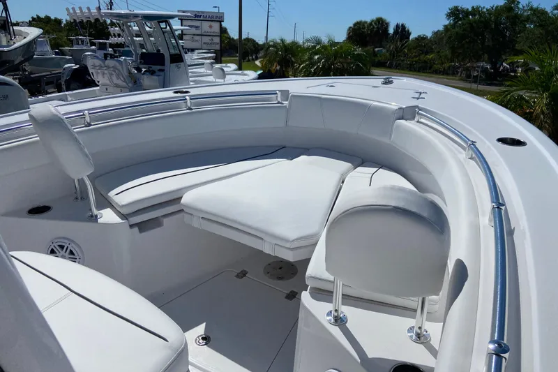 Slide: The Image of 2025 Sportsman Open 212 Center Console boat with white seating and sleek design. - 23