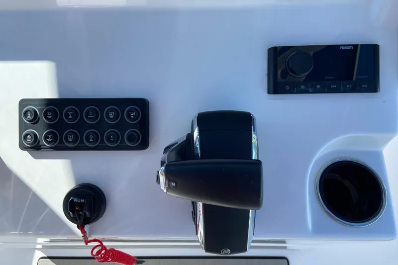 Slide: The Image of 2025 Sportsman 212 Open boat with blue T-top, featuring speakers and LED lights. - 26