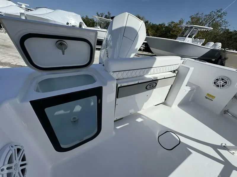 Slide: The Image of 2025 Sportsman 212 Open boat interior with storage compartments and seating. - 4