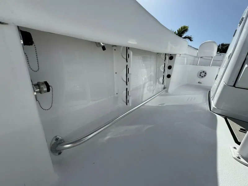 Slide: The Image of 2025 Sportsman 212 Open boat interior with sleek white design and stainless steel features. - 9