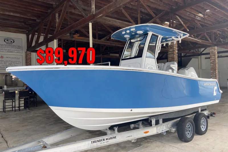 The Image of 2025 Sportsman Open 212 Center Console boat, blue, priced at $89,970, on trailer. - 0