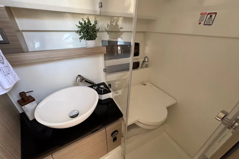 Slide: The Image of 2024 Jeanneau Leader 9.0 WA Series 2 bathroom with modern sink and toilet. - 14