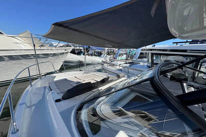 Slide: The Image of 2024 Jeanneau Leader 9.0 WA Series 2 boat with sunshade at marina. - 15