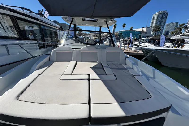 Slide: The Image of 2024 Jeanneau Leader 9.0 WA Series 2 boat with spacious sunbathing deck at marina. - 16