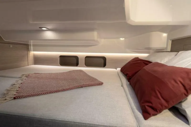 Slide: The Image of 2024 Jeanneau Leader 9.0 WA Series 2 cabin interior with kitchenette and seating area. - 9