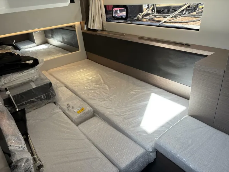 Slide: The Image of Interior cabin of 2025 Jeanneau 1295 FLY yacht with modern furnishings. - 22