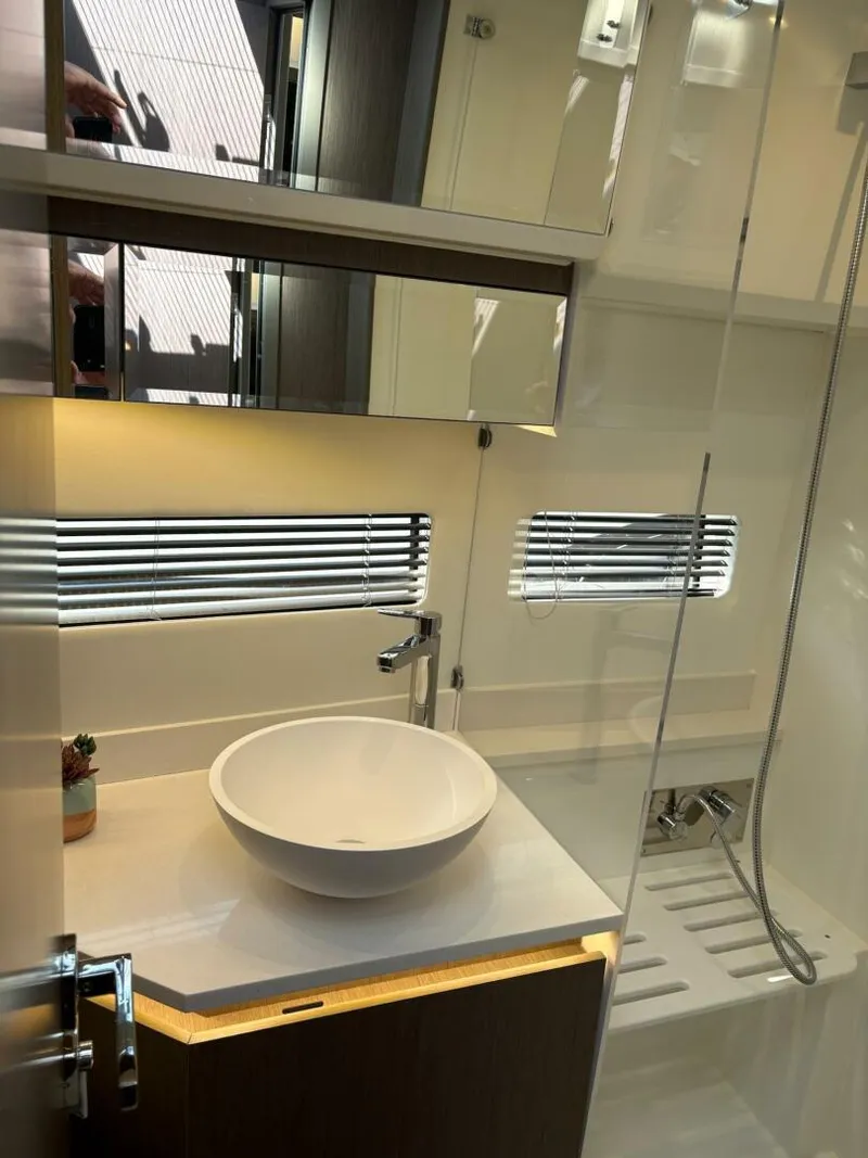 Slide: The Image of Modern bathroom interior on 2025 Jeanneau 1295 FLY yacht, featuring sleek design and fixtures. - 24