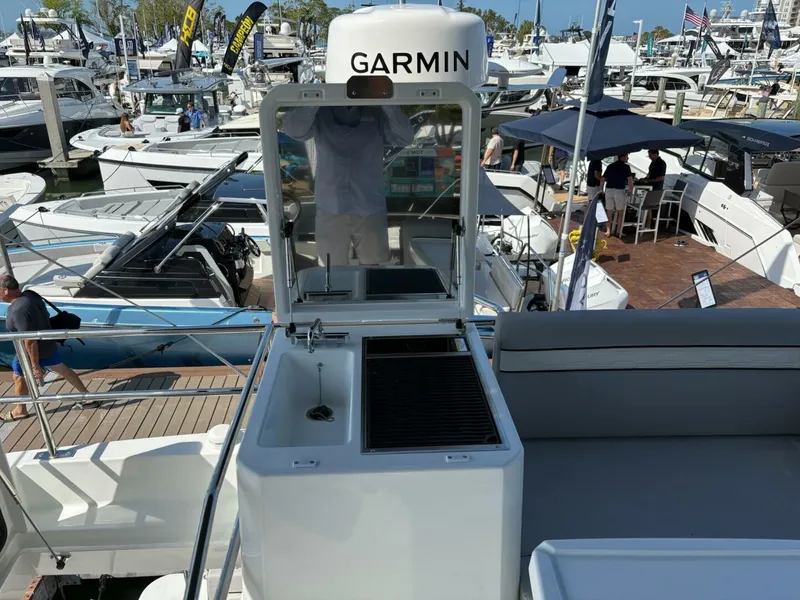 Slide: The Image of 2025 Jeanneau 1295 FLY yacht with Garmin equipment at a boat show. - 9
