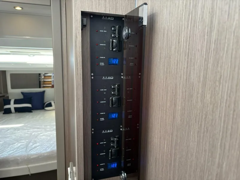Slide: The Image of Electrical panel inside 2025 Jeanneau 1295 FLY yacht cabin, showcasing modern controls. - 20