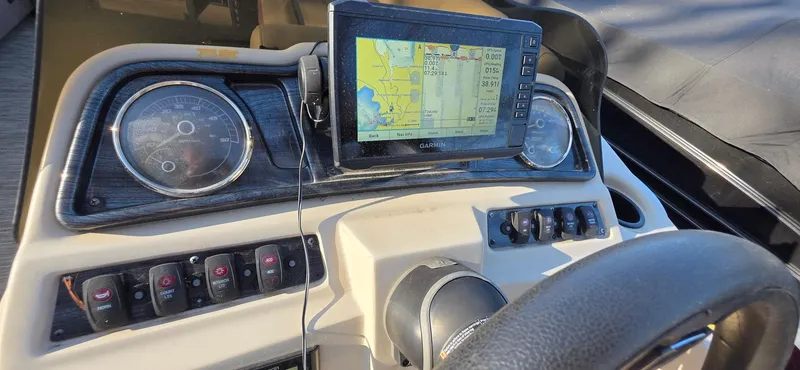 Slide: The Image of Dashboard of 2022 Godfrey Sweetwater 2286 FS with navigation system and controls. - 17