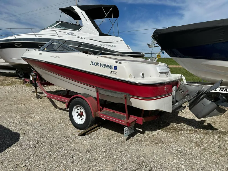 Slide: The Image of 1998 Four Winns 190 Horizon boat on trailer, parked outdoors, sunny day. - 0