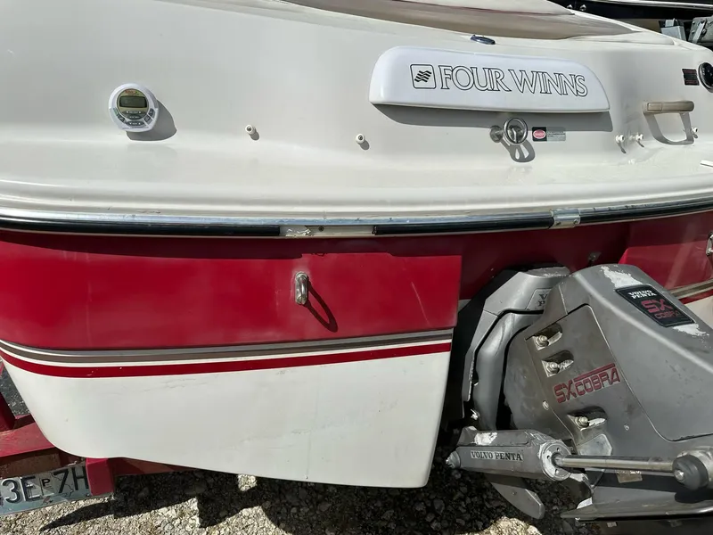 Slide: The Image of 1998 Four Winns 190 Horizon boat, red and white exterior, rear view with outboard motor. - 11