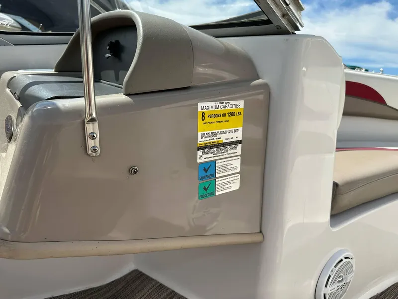 Slide: The Image of 1998 Four Winns 190 Horizon boat interior with capacity label and seating. - 15