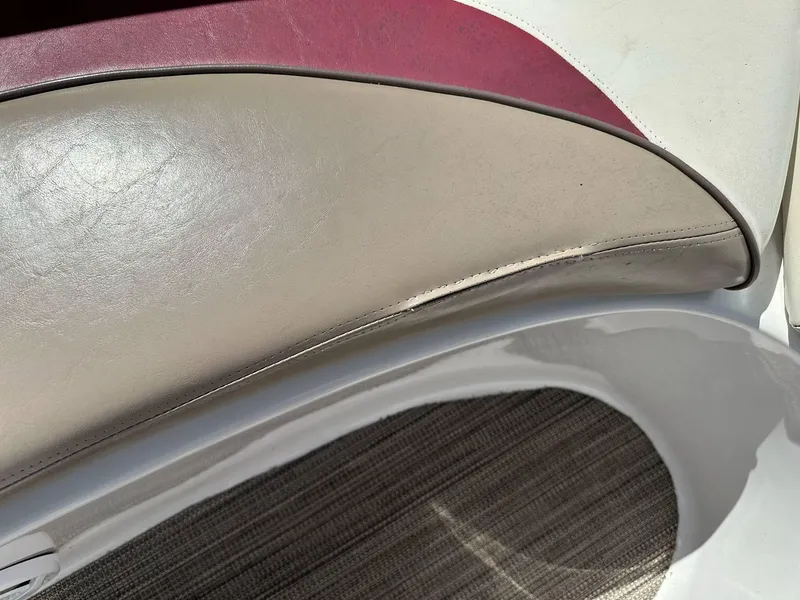 Slide: The Image of 1998 Four Winns 190 Horizon boat interior with beige and maroon upholstery. - 17