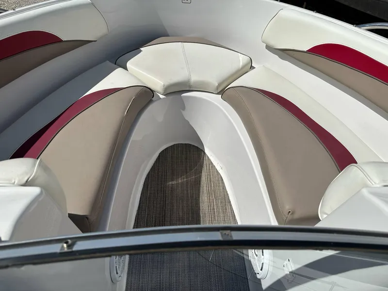 Slide: The Image of Interior of 1998 Four Winns 190 Horizon boat with cushioned seating. - 18