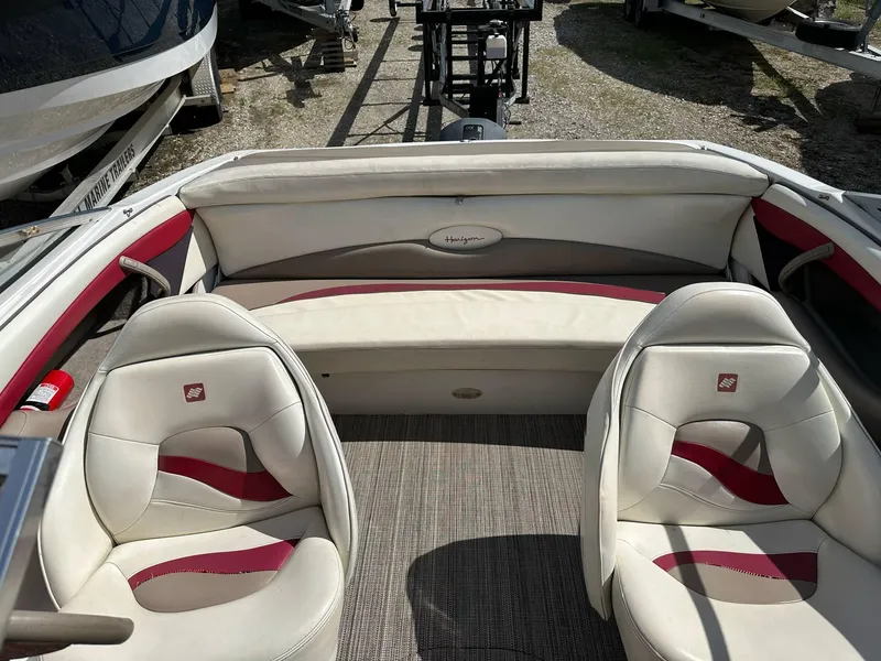 Slide: The Image of 1998 Four Winns 190 Horizon boat interior with white and red seating. - 23