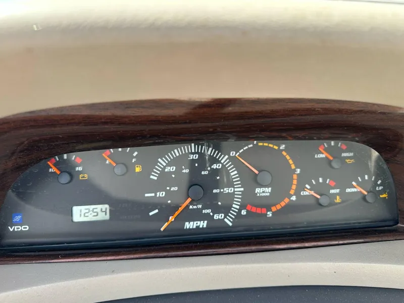 Slide: The Image of Dashboard of a 1998 Four Winns 190 Horizon boat showing speedometer and gauges. - 28