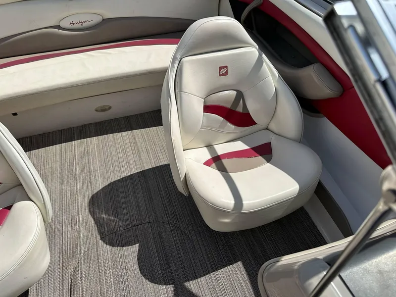 Slide: The Image of Interior of 1998 Four Winns 190 Horizon boat with white and red seating. - 29