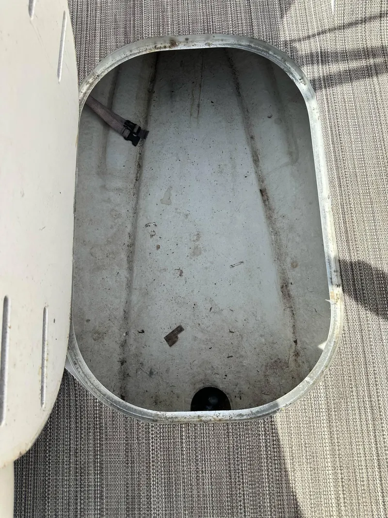 Slide: The Image of Open storage compartment on a 1998 Four Winns 190 Horizon boat. - 32