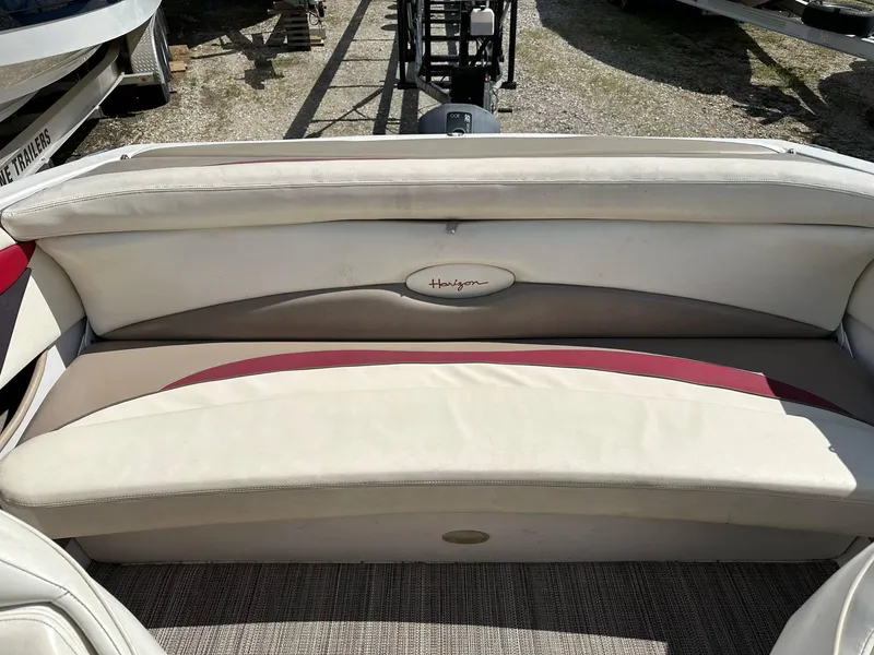 Slide: The Image of 1998 Four Winns 190 Horizon boat interior with beige and red seating. - 4
