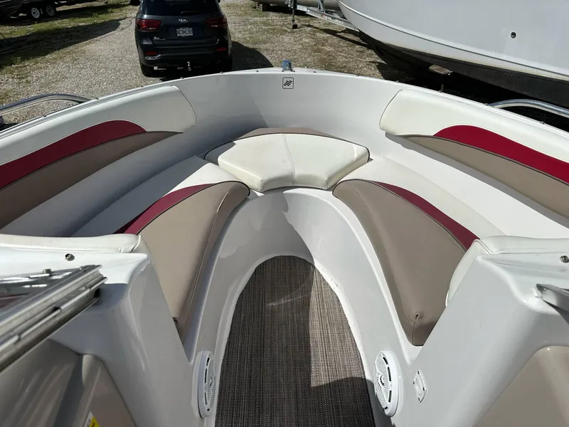 Slide: The Image of 1998 Four Winns 190 Horizon boat interior with cushioned seating and carpeted floor. - 6