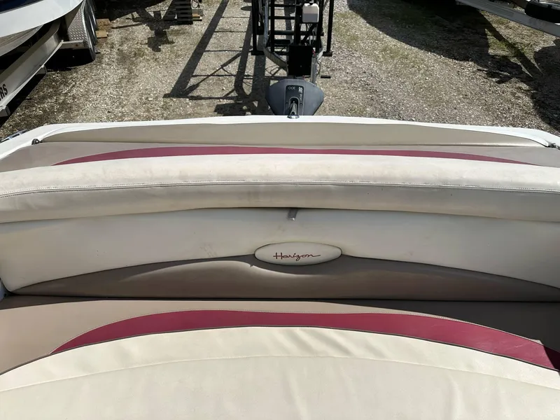 Slide: The Image of 1998 Four Winns 190 Horizon boat interior with beige and maroon seating. - 7