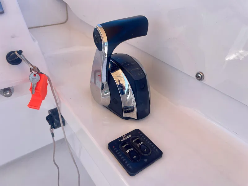 Slide: The Image of Throttle control and remote on a 1966 Bertram 25 Moppie boat. - 12