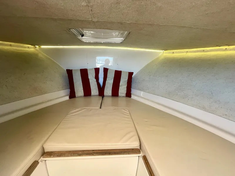 Slide: The Image of Interior cabin of a 1966 Bertram 25 Moppie with striped cushions. - 15