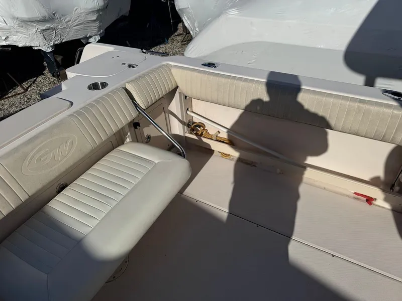 Slide: The Image of 2007 Grady-White Journey 258 boat interior with seating and shadow. - 17