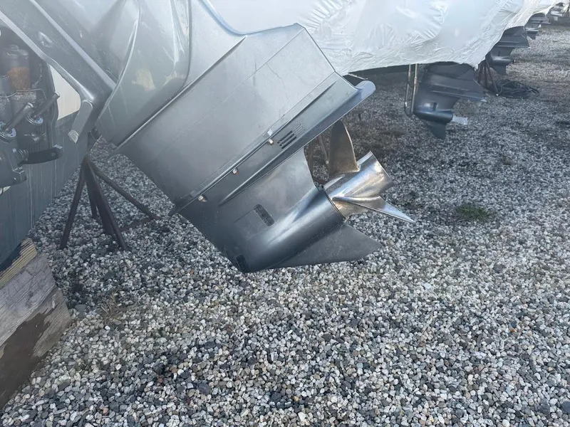 Slide: The Image of 2007 Grady-White Journey 258 boat propeller on gravel surface. - 18