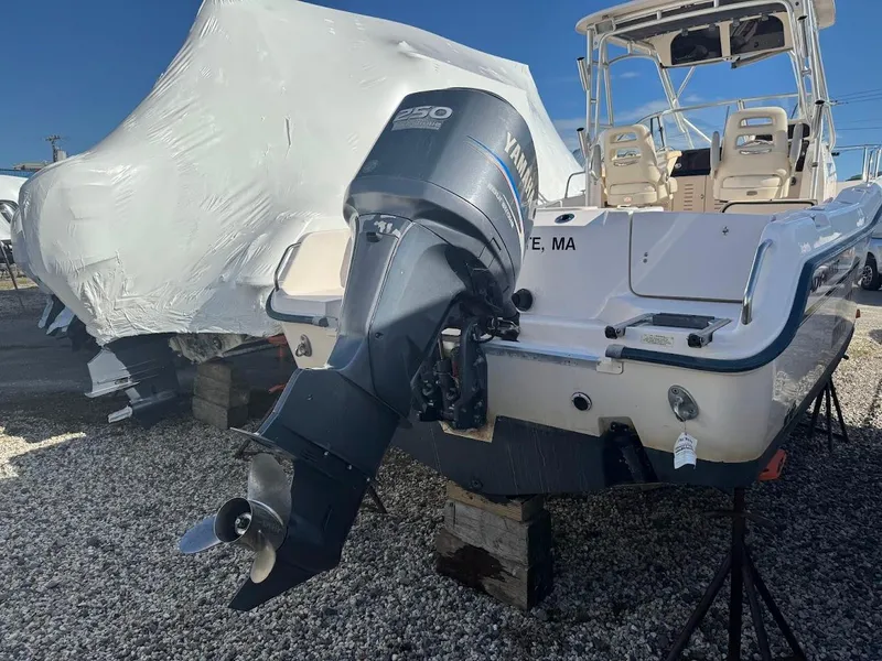 Slide: The Image of 2007 Grady-White Journey 258 boat with Yamaha outboard motor, parked on gravel. - 4