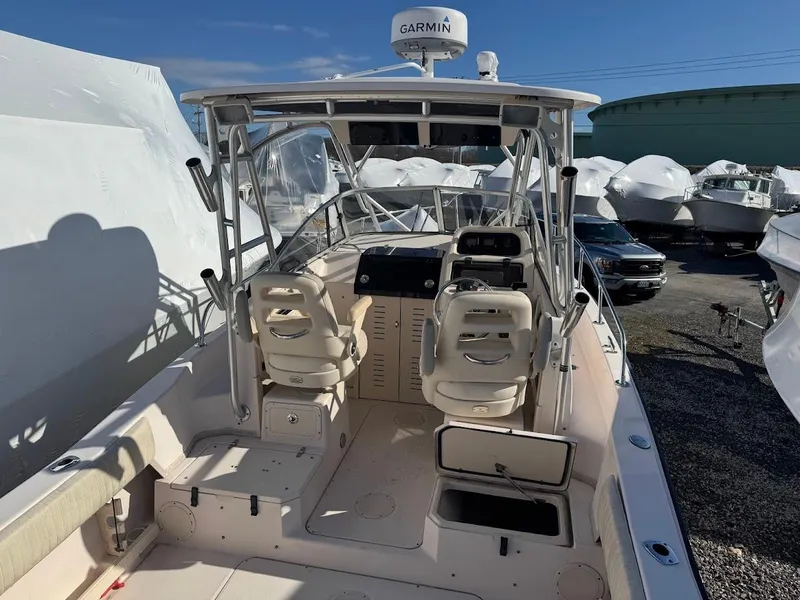 Slide: The Image of 2007 Grady-White Journey 258 boat with Garmin radar, docked in a marina. - 6