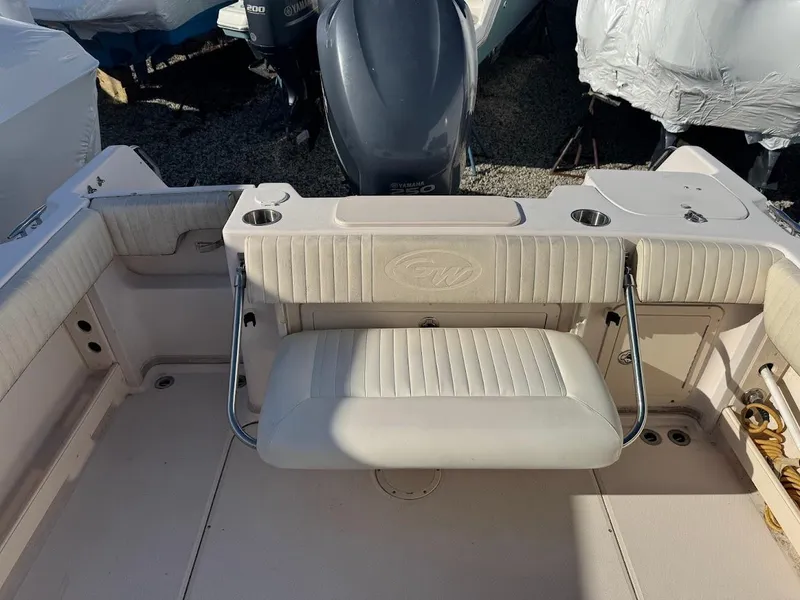 Slide: The Image of 2007 Grady-White Journey 258 boat interior with foldable seating and engine view. - 8