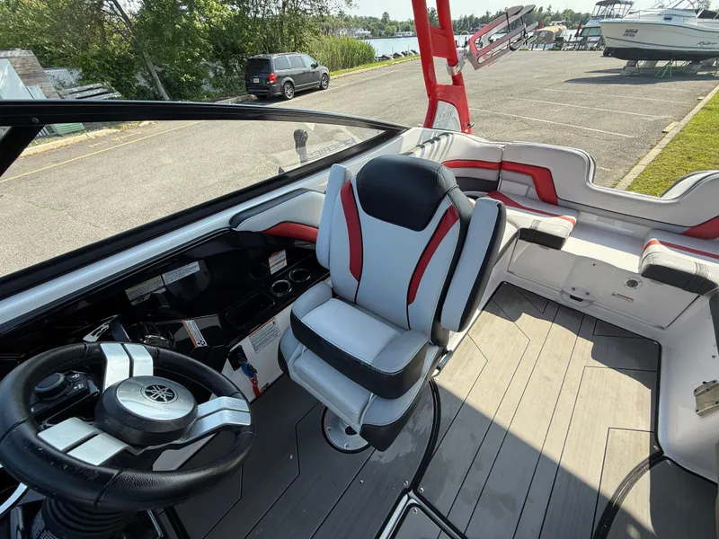 Slide: The Image of 2019 Yamaha Boats 242X E-Series interior with steering wheel and seating. - 17