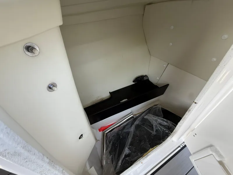 Slide: The Image of Interior storage compartment of 2019 Yamaha Boats 242X E-Series. - 20