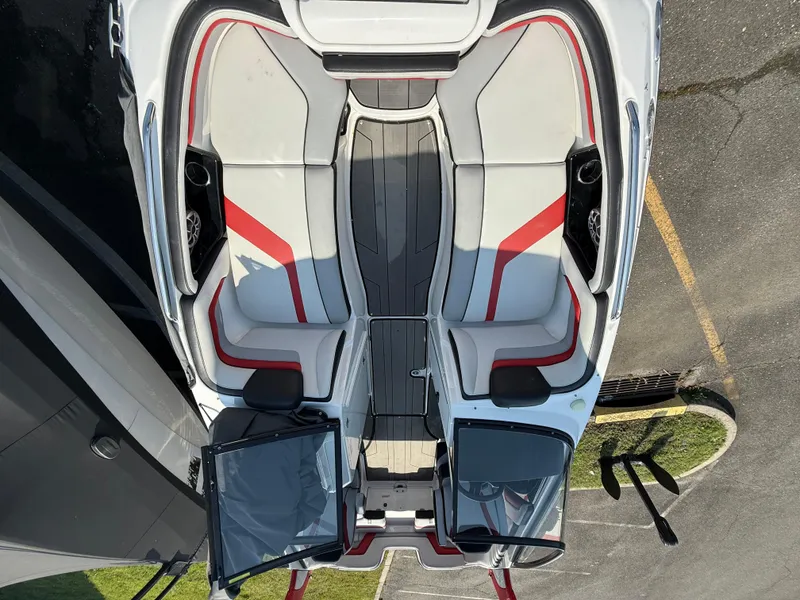 Slide: The Image of 2019 Yamaha Boats 242X E-Series interior with red accents and seating layout. - 24