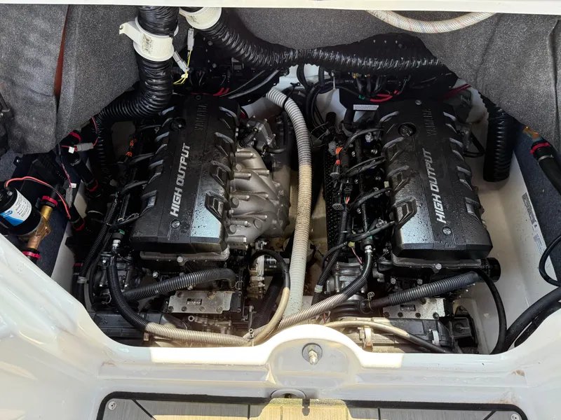 Slide: The Image of 2019 Yamaha Boats 242X E-Series engine compartment with dual high-output engines. - 25