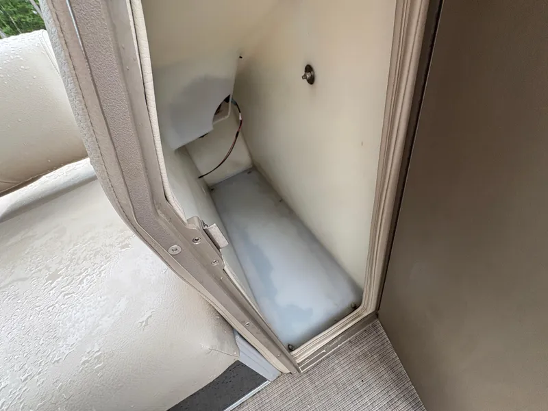 Slide: The Image of Storage compartment inside a 2022 Sun Tracker PARTY BARGE boat. - 12