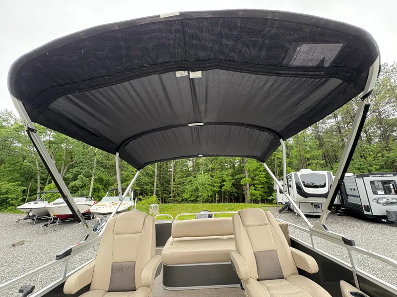 Slide: The Image of 2022 Sun Tracker PARTY BARGE with canopy, featuring comfortable seating and outdoor setting. - 21