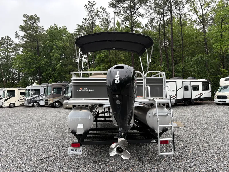 Slide: The Image of 2022 Sun Tracker PARTY BARGE pontoon boat with 150 HP engine, parked in a lot. - 3