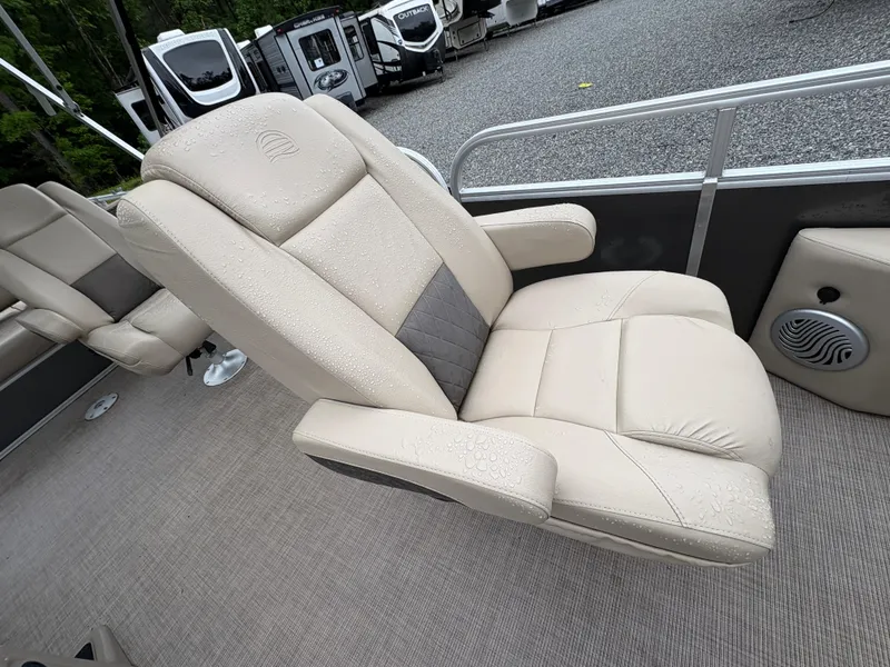Slide: The Image of 2022 Sun Tracker PARTY BARGE boat seat with beige upholstery and armrests. - 9