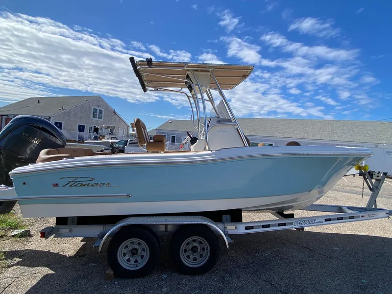 Slide: The Image of 2025 Pioneer 202 Islander boat on trailer under blue sky. - 3