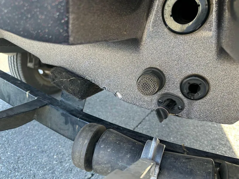 Slide: The Image of Close-up of a 2013 Nitro Z7 18' boat's rear section with trailer attachment. - 10